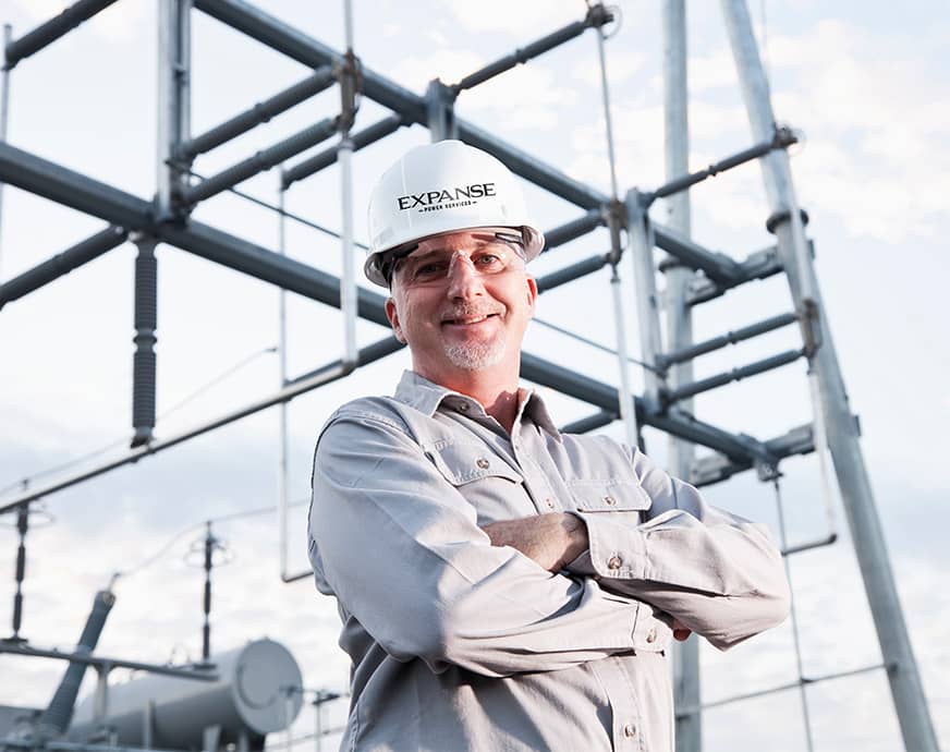 electrical engineer in front of substation